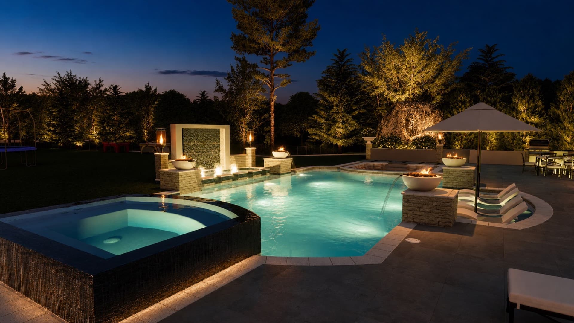 Pool design at night with lit fire features and raised spa